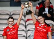 19 May 2024; Cork joint captains Meabh Cahalane, left, and Molly Lynch lift the cup after the Munster Senior Camogie Championship final match between Cork and Waterford at FBD Semple Stadium in Thurles, Tipperary. Photo by Brendan Moran/Sportsfile