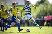 19 May 2024; Garbhan Friel of Cockhill Celtic in action against Jack Kelly of Ayrfield United during the Sports Direct Men’s FAI Cup First Round match between Cockhill Celtic and Ayrfield United at Charlie O'Donnell Sports Grounds in Buncrana, Donegal. Photo by Ramsey Cardy/Sportsfile