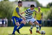 19 May 2024; Jack Mullan of Cockhill Celtic in action against Gerard Carroll of Ayrfield United during the Sports Direct Men’s FAI Cup First Round match between Cockhill Celtic and Ayrfield United at Charlie O'Donnell Sports Grounds in Buncrana, Donegal. Photo by Ramsey Cardy/Sportsfile