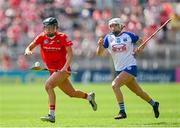 19 May 2024; Laura Hayes of Cork in action against Sarah Lacey of Waterford during the Munster Senior Camogie Championship final match between Cork and Waterford at FBD Semple Stadium in Thurles, Tipperary. Photo by Brendan Moran/Sportsfile