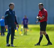 19 May 2024; Referee Conor Dourneen speaks to Wicklow manager Oisin McConville before showing him a yellow card during the Tailteann Cup Round 2 match between Wicklow and Laois at Echelon Park in Aughrim, Wicklow. Photo by Stephen Marken/Sportsfile