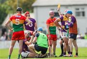 19 May 2024; Dion Wall of Carlow, 3, is shown a yellow card by referee Thomas Gleeson during the Leinster GAA Hurling Senior Championship Round 4 match between Carlow and Wexford at Netwatch Cullen Park in Carlow. Photo by Michael P Ryan/Sportsfile
