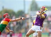 19 May 2024; Conor Hearne of Wexford in action against Niall Bolger of Carlow during the Leinster GAA Hurling Senior Championship Round 4 match between Carlow and Wexford at Netwatch Cullen Park in Carlow. Photo by Michael P Ryan/Sportsfile
