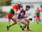 19 May 2024; Mikie Dwyer of Wexford in action against Paul Doyle of Carlow during the Leinster GAA Hurling Senior Championship Round 4 match between Carlow and Wexford at Netwatch Cullen Park in Carlow. Photo by Michael P Ryan/Sportsfile