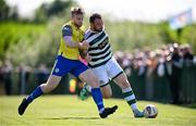 19 May 2024; Garbhan Friel of Cockhill Celtic in action against Jack Kelly of Ayrfield United during the Sports Direct Men’s FAI Cup First Round match between Cockhill Celtic and Ayrfield United at Charlie O'Donnell Sports Grounds in Buncrana, Donegal. Photo by Ramsey Cardy/Sportsfile