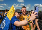 19 May 2024; Clare supporter Mairin Gallagher, from Lahinch, has a selfie taken with David Reidy of Clare after the Munster GAA Hurling Senior Championship Round 4 match between Clare and Waterford at Cusack Park in Ennis, Clare. Photo by Ray McManus/Sportsfile