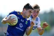 19 May 2024; Eoin Darcy of Wicklow in action against Simon Fingleton of Laois during the Tailteann Cup Round 2 match between Wicklow and Laois at Echelon Park in Aughrim, Wicklow. Photo by Stephen Marken/Sportsfile