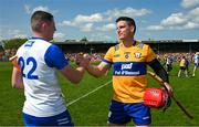 19 May 2024; John Conlon of Clare with Shane Bennett of Waterford after the Munster GAA Hurling Senior Championship Round 4 match between Clare and Waterford at Cusack Park in Ennis, Clare. Photo by Ray McManus/Sportsfile