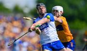19 May 2024; Ian Kenny of Waterford is tackled by Aidan McCarthy of Clare during the Munster GAA Hurling Senior Championship Round 4 match between Clare and Waterford at Cusack Park in Ennis, Clare. Photo by Ray McManus/Sportsfile