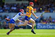 19 May 2024; Peter Duggan of Clare is tackled by Calum Lyons of Waterford during the Munster GAA Hurling Senior Championship Round 4 match between Clare and Waterford at Cusack Park in Ennis, Clare. Photo by Ray McManus/Sportsfile