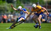 19 May 2024; Shane Bennett of Waterford is tackled by Conor Cleary of Clare during the Munster GAA Hurling Senior Championship Round 4 match between Clare and Waterford at Cusack Park in Ennis, Clare. Photo by Ray McManus/Sportsfile