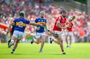 19 May 2024; Darragh Fitzgibbon of Cork is tackled by Cathal Barrett of Tipperary during the Munster GAA Hurling Senior Championship Round 4 match between Tipperary and Cork at FBD Semple Stadium in Thurles, Tipperary. Photo by Brendan Moran/Sportsfile