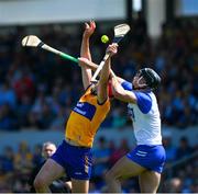 19 May 2024; Peter Duggan of Clare is tackled by Mark Fitzgerald of Waterford during the Munster GAA Hurling Senior Championship Round 4 match between Clare and Waterford at Cusack Park in Ennis, Clare. Photo by Ray McManus/Sportsfile