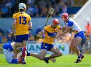 19 May 2024; Peter Duggan of Clare is tackled by Calum Lyons of Waterford during the Munster GAA Hurling Senior Championship Round 4 match between Clare and Waterford at Cusack Park in Ennis, Clare. Photo by Ray McManus/Sportsfile