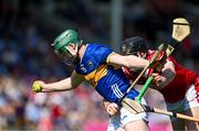 19 May 2024; Darragh Stakelum of Tipperary in action against Eoin Downey of Cork during the Munster GAA Hurling Senior Championship Round 4 match between Tipperary and Cork at FBD Semple Stadium in Thurles, Tipperary. Photo by Daire Brennan/Sportsfile