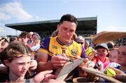 19 May 2024; Lee Chin of Wexford signs autographs for supporters after the Leinster GAA Hurling Senior Championship Round 4 match between Carlow and Wexford at Netwatch Cullen Park in Carlow. Photo by Michael P Ryan/Sportsfile