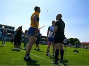 19 May 2024; Referee Liam Gordon tosses a coin between the two captains, Conor Cleary of Clare and Stephen Bennett of Waterford, before the Munster GAA Hurling Senior Championship Round 4 match between Clare and Waterford at Cusack Park in Ennis, Clare. Photo by Ray McManus/Sportsfile
