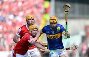 19 May 2024; Jake Morris of Tipperary in action against Niall O'Leary of Cork during the Munster GAA Hurling Senior Championship Round 4 match between Tipperary and Cork at FBD Semple Stadium in Thurles, Tipperary. Photo by Daire Brennan/Sportsfile