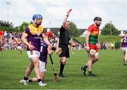 19 May 2024; John Michael Nolan of Carlow, right, is shown a red card by referee Thomas Gleeson during the Leinster GAA Hurling Senior Championship Round 4 match between Carlow and Wexford at Netwatch Cullen Park in Carlow. Photo by Michael P Ryan/Sportsfile