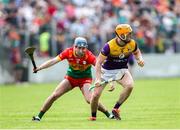 19 May 2024; Damien Reck of Wexford in action against Ciaran Whelan of Carlow during the Leinster GAA Hurling Senior Championship Round 4 match between Carlow and Wexford at Netwatch Cullen Park in Carlow. Photo by Michael P Ryan/Sportsfile