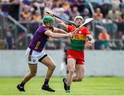 19 May 2024; James Doyle of Carlow in action against Matthew O'Hanlon of Wexford during the Leinster GAA Hurling Senior Championship Round 4 match between Carlow and Wexford at Netwatch Cullen Park in Carlow. Photo by Michael P Ryan/Sportsfile