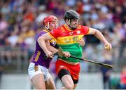 19 May 2024; Conor Lawlor of Carlow in action against Lee Chin of Wexford during the Leinster GAA Hurling Senior Championship Round 4 match between Carlow and Wexford at Netwatch Cullen Park in Carlow. Photo by Michael P Ryan/Sportsfile