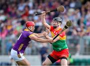 19 May 2024; Conor Lawlor of Carlow in action against Lee Chin of Wexford during the Leinster GAA Hurling Senior Championship Round 4 match between Carlow and Wexford at Netwatch Cullen Park in Carlow. Photo by Michael P Ryan/Sportsfile