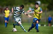 19 May 2024; Corey McBride of Cockhill Celtic in action against Chris McFadden of Ayrfield United during the Sports Direct Men’s FAI Cup First Round match between Cockhill Celtic and Ayrfield United at Charlie O'Donnell Sports Grounds in Buncrana, Donegal. Photo by Ramsey Cardy/Sportsfile
