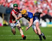 19 May 2024; Ronan Maher of Tipperary in action against Seamus Harnedy of Cork during the Munster GAA Hurling Senior Championship Round 4 match between Tipperary and Cork at FBD Semple Stadium in Thurles, Tipperary. Photo by Daire Brennan/Sportsfile
