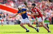 19 May 2024; Patrick Maher of Tipperary is tackled by Eoin Downey of Cork during the Munster GAA Hurling Senior Championship Round 4 match between Tipperary and Cork at FBD Semple Stadium in Thurles, Tipperary. Photo by Brendan Moran/Sportsfile