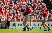 19 May 2024; John McGrath of Tipperary is tackled by Mark Coleman of Cork during the Munster GAA Hurling Senior Championship Round 4 match between Tipperary and Cork at FBD Semple Stadium in Thurles, Tipperary. Photo by Brendan Moran/Sportsfile
