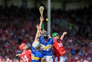 19 May 2024; Alan Connolly, left, and Seamus Harnedy of Cork in action against Michael Breen, left, and Dan McCormack of Tipperary during the Munster GAA Hurling Senior Championship Round 4 match between Tipperary and Cork at FBD Semple Stadium in Thurles, Tipperary. Photo by Daire Brennan/Sportsfile