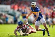 19 May 2024; Cork goalkeeper Patrick Collins is tackled by Patrick Maher of Tipperary during the Munster GAA Hurling Senior Championship Round 4 match between Tipperary and Cork at FBD Semple Stadium in Thurles, Tipperary. Photo by Brendan Moran/Sportsfile