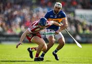 19 May 2024; Cork goalkeeper Patrick Collins is tackled by Patrick Maher of Tipperary during the Munster GAA Hurling Senior Championship Round 4 match between Tipperary and Cork at FBD Semple Stadium in Thurles, Tipperary. Photo by Brendan Moran/Sportsfile
