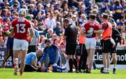 19 May 2024; Ronan Maher of Tipperary and Ethan Twomey of Cork are treated by medical personnel after a clash of heads during the Munster GAA Hurling Senior Championship Round 4 match between Tipperary and Cork at FBD Semple Stadium in Thurles, Tipperary. Photo by Brendan Moran/Sportsfile