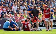 19 May 2024; Ronan Maher of Tipperary and Ethan Twomey of Cork are treated by medical personnel after a clash of heads during the Munster GAA Hurling Senior Championship Round 4 match between Tipperary and Cork at FBD Semple Stadium in Thurles, Tipperary. Photo by Brendan Moran/Sportsfile