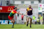 19 May 2024; Cathal Dunbar of Wexford in action against Tony Lawlor of Carlow during the Leinster GAA Hurling Senior Championship Round 4 match between Carlow and Wexford at Netwatch Cullen Park in Carlow. Photo by Michael P Ryan/Sportsfile