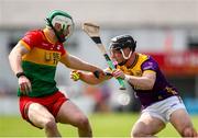 19 May 2024; Mikie Dwyer of Wexford in action against Paul Doyle of Carlow during the Leinster GAA Hurling Senior Championship Round 4 match between Carlow and Wexford at Netwatch Cullen Park in Carlow. Photo by Michael P Ryan/Sportsfile