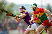 19 May 2024; Mikie Dwyer of Wexford in action against Paul Doyle of Carlow  during the Leinster GAA Hurling Senior Championship Round 4 match between Carlow and Wexford at Netwatch Cullen Park in Carlow. Photo by Michael P Ryan/Sportsfile