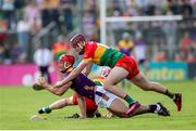 19 May 2024; Lee Chin of Wexford in action against Jack McCullagh of Carlow during the Leinster GAA Hurling Senior Championship Round 4 match between Carlow and Wexford at Netwatch Cullen Park in Carlow. Photo by Michael P Ryan/Sportsfile