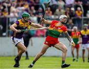 19 May 2024; James Doyle of Carlow in action against Matthew O'Hanlon of Wexford during the Leinster GAA Hurling Senior Championship Round 4 match between Carlow and Wexford at Netwatch Cullen Park in Carlow. Photo by Michael P Ryan/Sportsfile