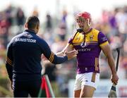 19 May 2024; Lee Chin of Wexford with Wexford manager Keith Rossiter following a substitution during the Leinster GAA Hurling Senior Championship Round 4 match between Carlow and Wexford at Netwatch Cullen Park in Carlow. Photo by Michael P Ryan/Sportsfile
