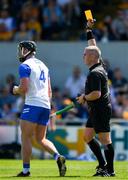 19 May 2024; Iarlaith Daly of Waterford is shown a yello card by referee Liam Gordon during the Munster GAA Hurling Senior Championship Round 4 match between Clare and Waterford at Cusack Park in Ennis, Clare. Photo by Ray McManus/Sportsfile