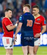 17 May 2024; Ben Healy of Edinburgh, 10, with Calvin Nash, left, and Shane Daly of Munster after the United Rugby Championship match between Edinburgh and Munster at the Hive Stadium in Edinburgh, Scotland. Photo by Mark Scates/Sportsfile