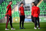 20 May 2024; Derry City players, from left, Shane McEleney, Michael Duffy, Patrick Hoban and Paul McMullan before the SSE Airtricity Men's Premier Division match between Shamrock Rovers and Derry City at Tallaght Stadium in Dublin. Photo by Ramsey Cardy/Sportsfile