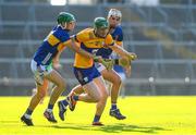 20 May 2024; Harry Doherty of Clare in action against David Ryan and Euan Murray of Tipperary during the Electric Ireland Munster GAA Hurling Minor Championship Final match between Clare and Tipperary at TUS Gaelic Grounds in Limerick. Photo by Matt Browne/Sportsfile