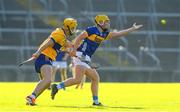 20 May 2024; Tiarnan Ryan of Tipperary in action against Matthew Corbett of Clare during the Electric Ireland Munster GAA Hurling Minor Championship Final match between Clare and Tipperary at TUS Gaelic Grounds in Limerick. Photo by Matt Browne/Sportsfile