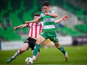 20 May 2024; Johnny Kenny of Shamrock Rovers is fouled by Cameron McJannet of Derry City, resulting in a Shamrock Rovers penalty, during the SSE Airtricity Men's Premier Division match between Shamrock Rovers and Derry City at Tallaght Stadium in Dublin. Photo by Ramsey Cardy/Sportsfile