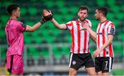 20 May 2024; Derry City goalkeeper Brian Maher is congratulated by Will Patching, centre, and Michael Duffy, after saving a Shamrock Rovers penalty during the SSE Airtricity Men's Premier Division match between Shamrock Rovers and Derry City at Tallaght Stadium in Dublin. Photo by Ramsey Cardy/Sportsfile
