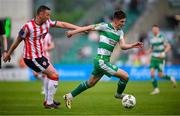 20 May 2024; Johnny Kenny of Shamrock Rovers in action against Shane McEleney of Derry City during the SSE Airtricity Men's Premier Division match between Shamrock Rovers and Derry City at Tallaght Stadium in Dublin. Photo by Ramsey Cardy/Sportsfile